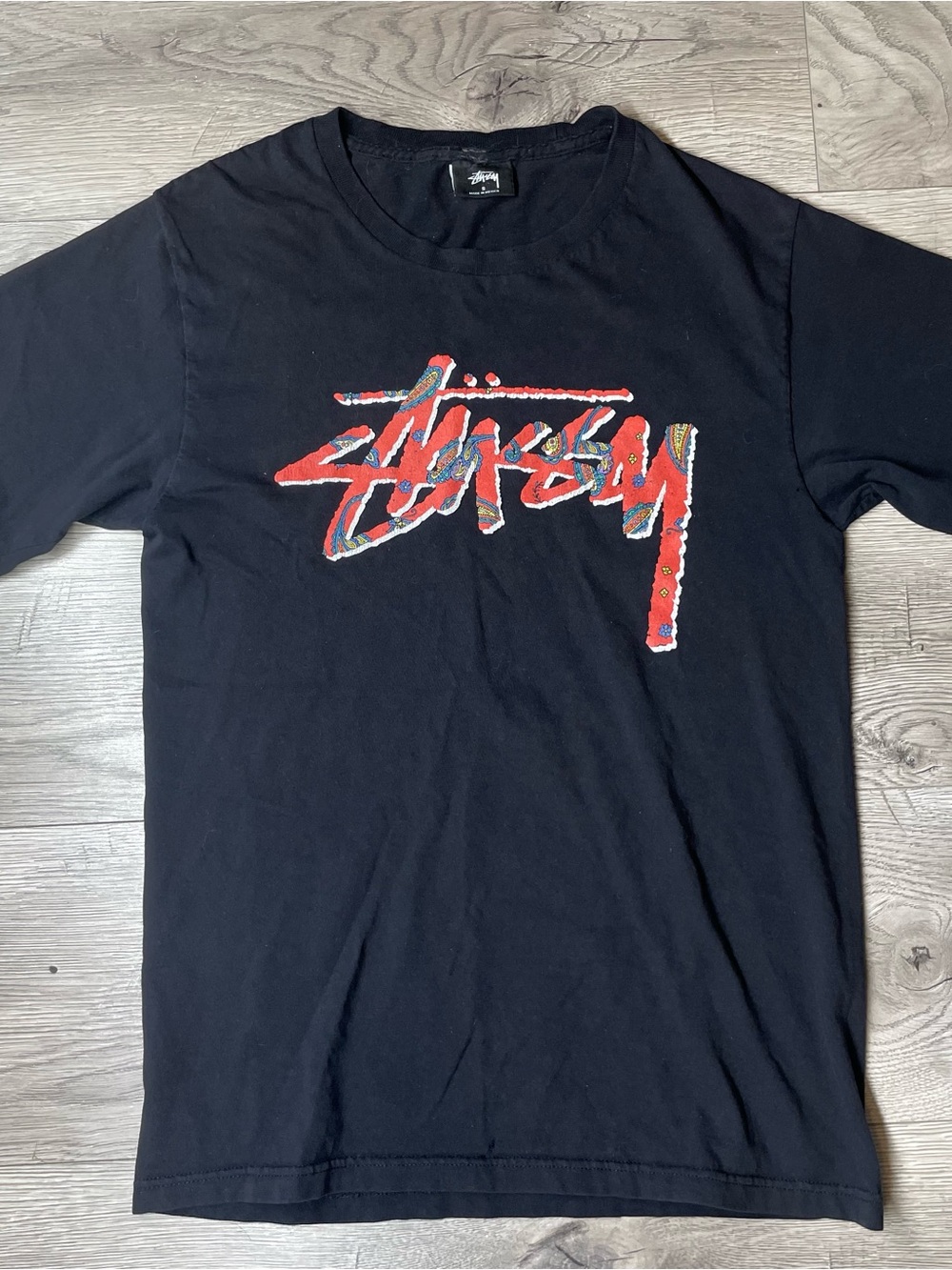Stussy Black Short-Sleeve Tee with Red Script Logo